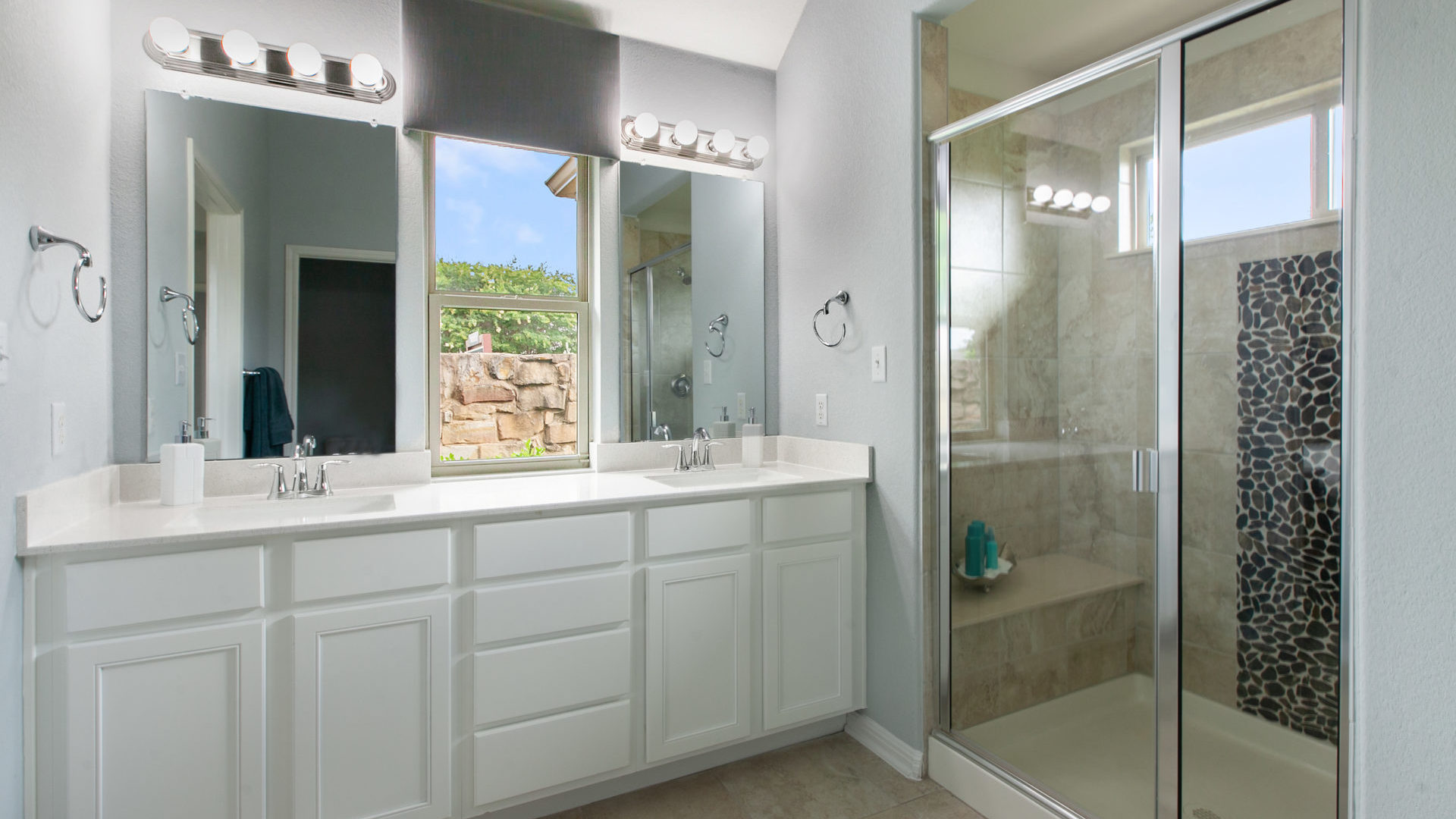The Campania Blanco Vista Model Home owner's suite bathroom